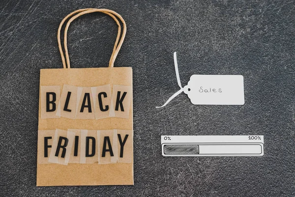 Black friday shopping bag with Sales price tag and progress bar — Stock Photo, Image