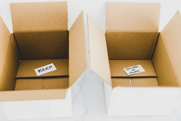 Deluttering concept, storage boxes to sort between objects to k — Stock fotografie