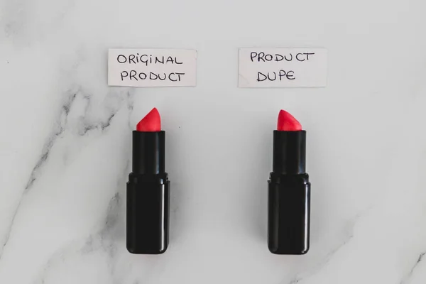 beauty industry competition, two identhical looking lipsticks wi