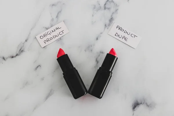 beauty industry competition, two identhical looking lipsticks wi