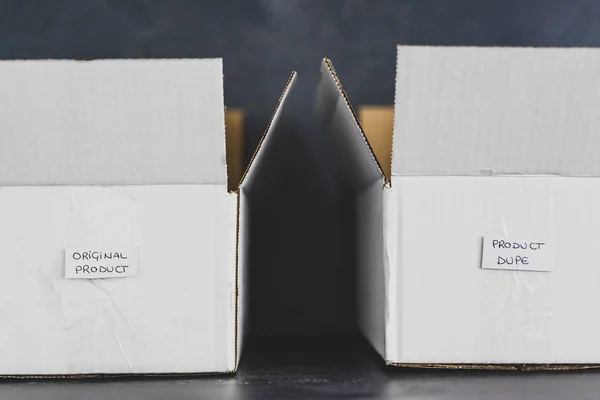 Original product vs dupe imitation label inside delivery parcel — Stock Photo, Image