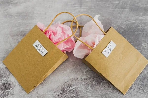 Orijinal ürün aldatmacaya karşı, etiketli alışveriş torbaları si