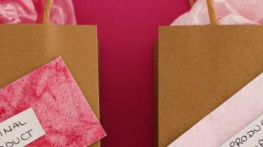 original product vs dupe imitation label on shopping bags with similar color paper and camera zooming out to reveal the scene, concept of competition and knock-off items