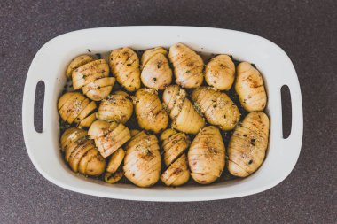 potato bake with herbs about to go in the oven