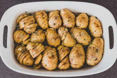 potato bake with herbs about to go in the oven