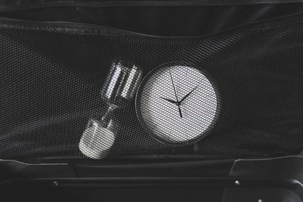 Time to travel or delay during a trip,  empty suitcase with cloc — 스톡 사진