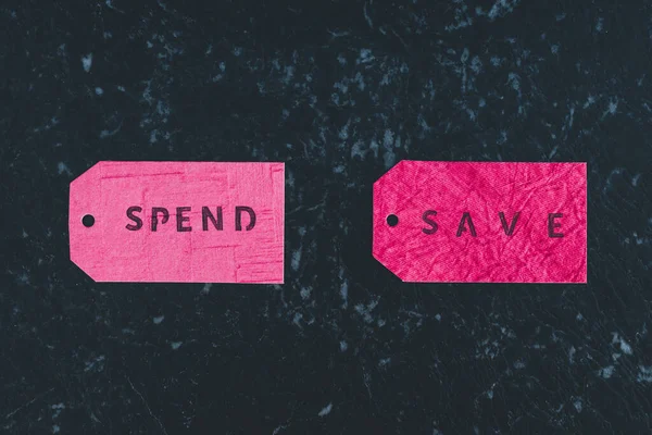 Spend vs Save texts on price tags, budgeting concept — Stock Photo, Image