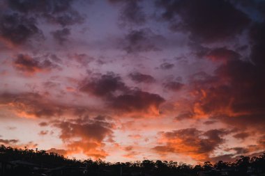 HOBART, TASMANIA - March 4th, 2020: spectacular pink and purple sunset over Kingston Beach, a popular location near Hobart