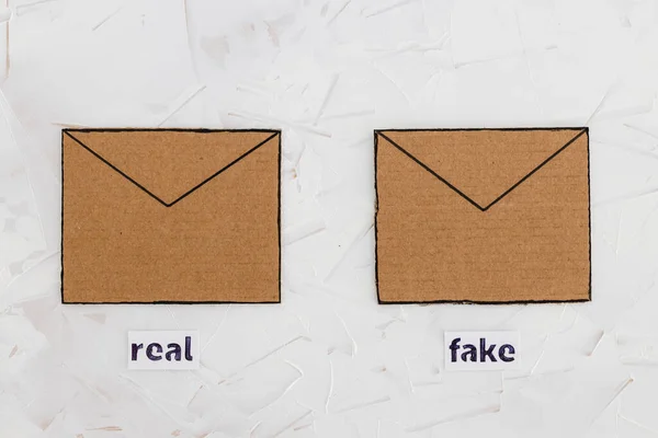 trust-wrothy vs fake emails or online scams concept, email envelop icons with real vs fake labels on them