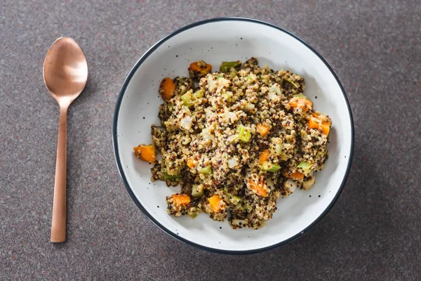 healthy plant-based food recipes concept, vegan ginger quinoa salad with chopped celeri onion and carrot