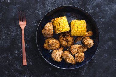 healthy plant-based food recipes concept, vegan buffalo cauliflower florets and grilled corn cobs clipart