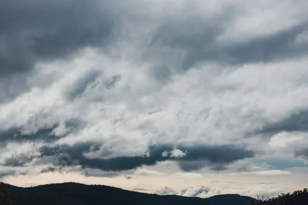 stormy clouds rolling over the mountains in Tasmania near Mount Wellington