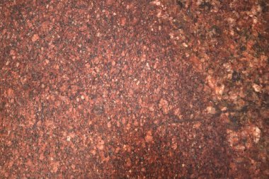 Arka plan. Doku. Doğal cilalanmış taş. Kırmızı granit.