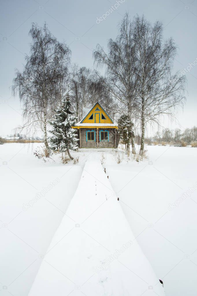 snowed embankment to farm house