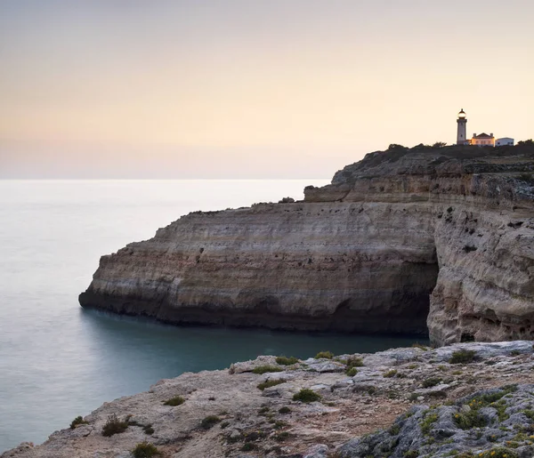 Bay between rocks and lighthouse — Stock Photo, Image