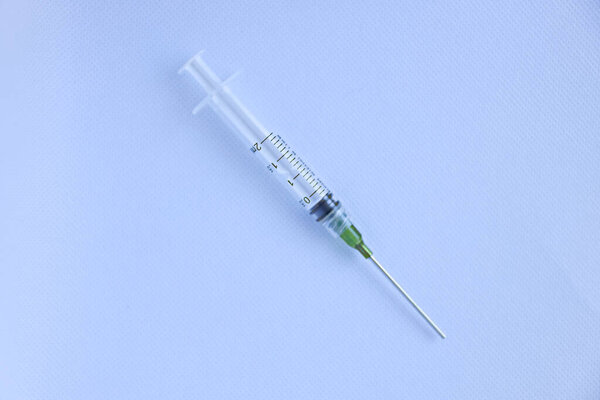 Detail of covid-19 vaccine syringe; novel corona virus treatment and prevention research concept
