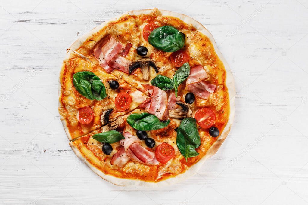 Top view of Italian PIZZA with mushrooms, basil, tomato, olives and cheese and bacon. WITHOUT one piece.  white wooden table background. Look as Prosciutto, Capricciosa, Funghi, Cotto PIZZA. Ideal for commercial