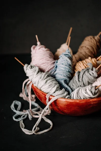 Rolled thin cloth material made of wool and cotton. Perfect use for tying event invitation or candles. Fabric made cloth on the bowl with variety of colors.