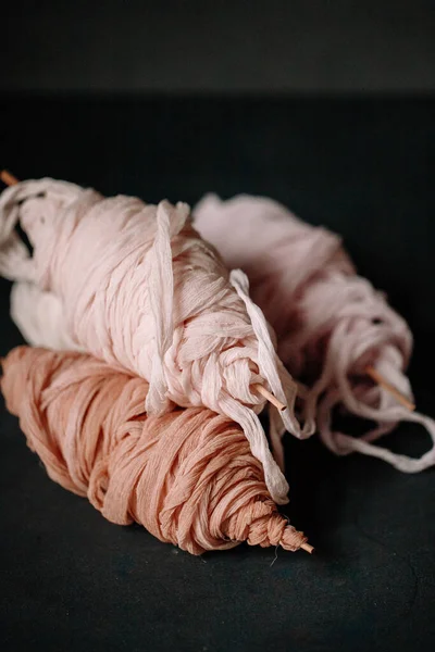Focus view of roll thin cloth material made of wool and cotton. Perfect use for tying event invitation or candles. Fabric made cloth on the bowl with the shade of peach pastel color.