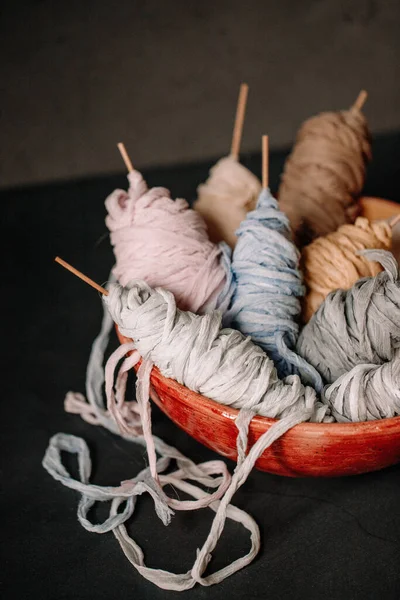 Rolled thin cloth material made of wool and cotton. Perfect use for tying event invitation or candles. Fabric made cloth on the bowl with variety of colors.