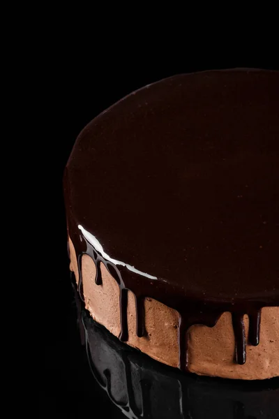 Delicious chocolate mousse cake coated with shiny chocolate glaze. Lava cake. Confectionery photography concept.