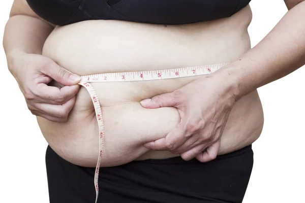 Karnı ölçü ile onun streç işaretleri gösteren Asyalı kadın 