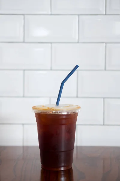 Ice black coffee on wood table