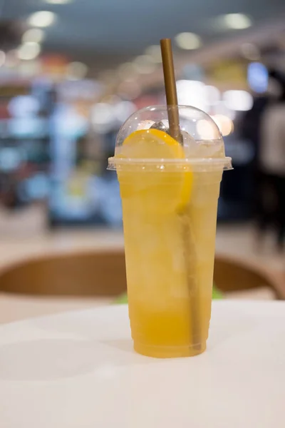 Iced tea mix with lemonade in takeaway tall glass