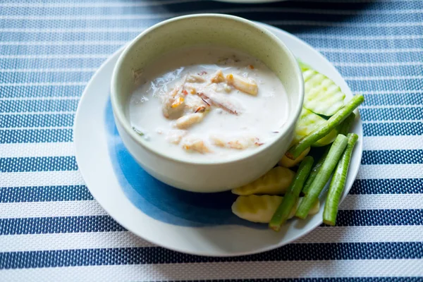 Stew crab with coconut milk dip with fresh vegetables