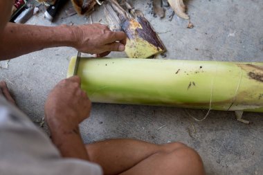 Local people cut trunk of a banana into floating pieces for make krathong for Loy Krathong festival. Loy Krathong Festival and river goddess worship ceremony, the full moon of the 12th month Be famous festival of Thailand.