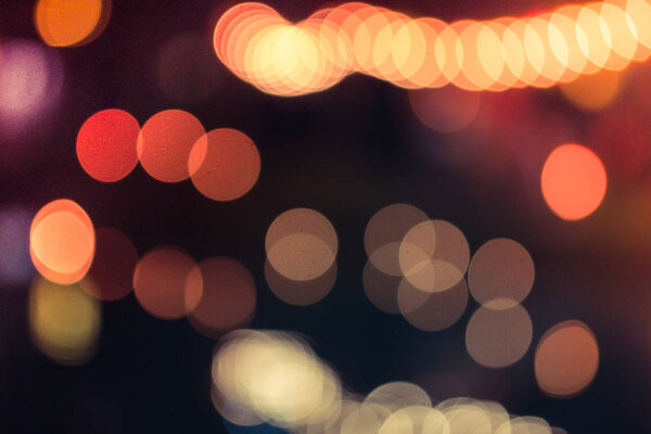 Abstract blurred bright yellow orange vintage lights bokeh background