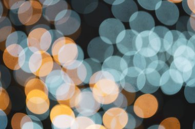 Güzel parlak turuncu ve mavi Bokeh ışıkları. Festivalsel Doku. 