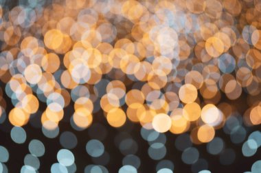 Güzel parlak turuncu ve mavi Bokeh ışıkları. Festivalsel Doku. 