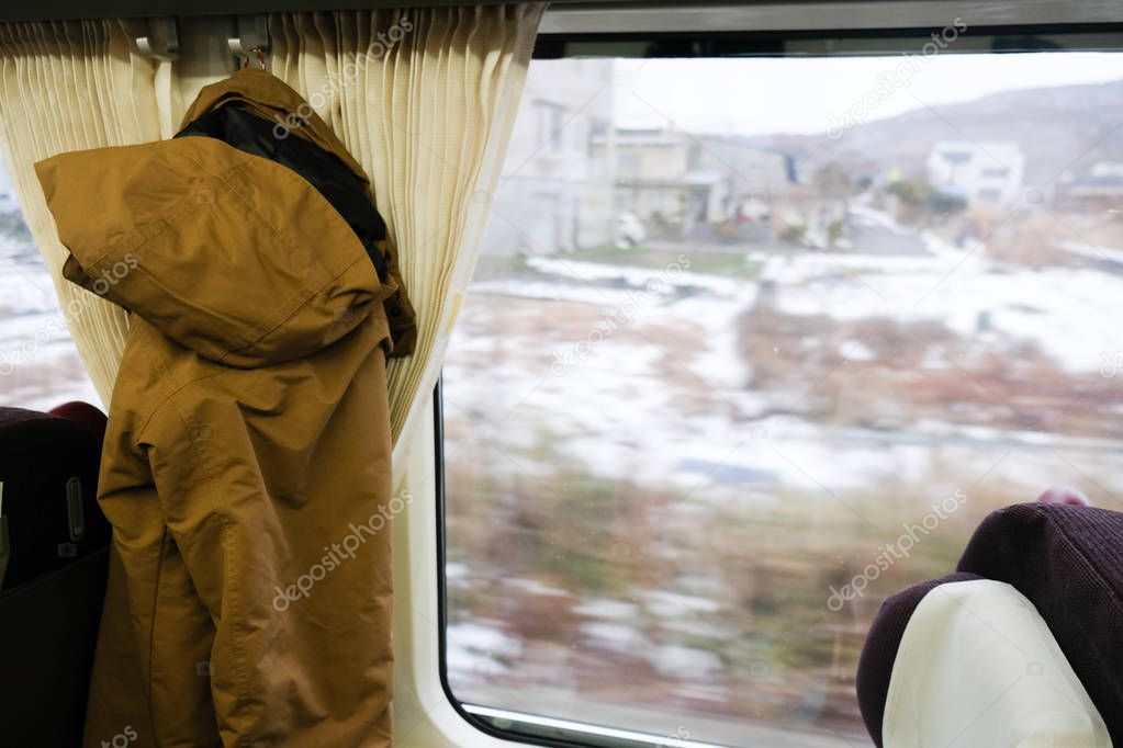Looking through window with snow travels on a train in Hokkaido 