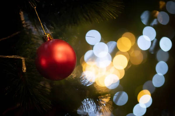Close up of beautiful Christmas decoration- bauble Christmas red ball hanging on the Christmas tree — Stock Photo, Image