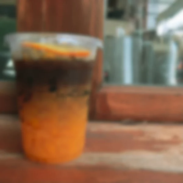 Hintergrund verschwimmen Espresso-Aufnahme gemischt mit Orangensaft — Stockfoto