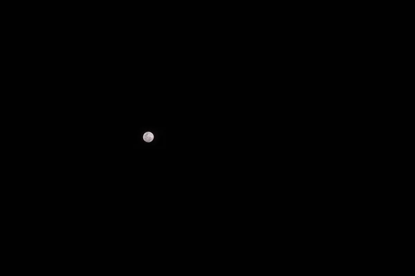 Full moon against a black night sky — 스톡 사진