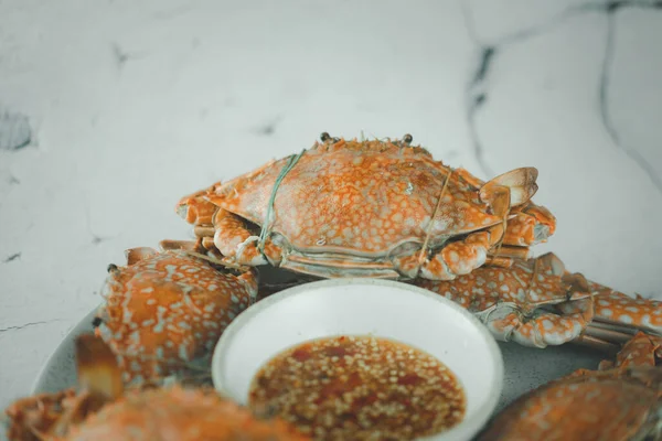 Steamed crab in a dish served with Thai style spicy dip