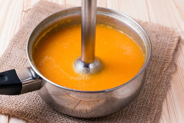 Pumpkin pureed for soup with blender — Stock Photo, Image