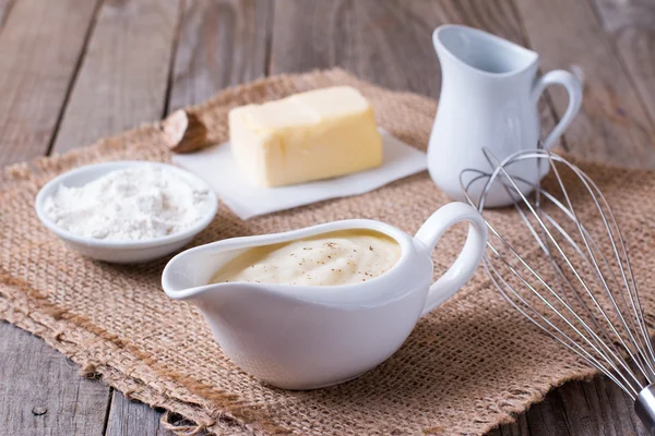 Bechamel sauce on kitchen table — Stock Photo, Image