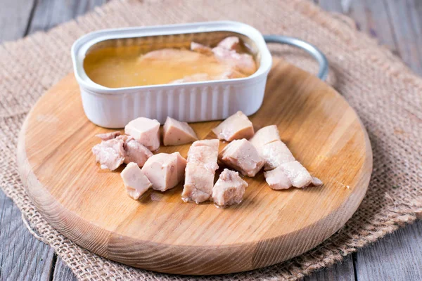 Liver of cod on a wooden board — Stock Photo, Image