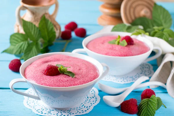 Tasty strawberry mousse in a bowl on wooden table — Stock Photo, Image