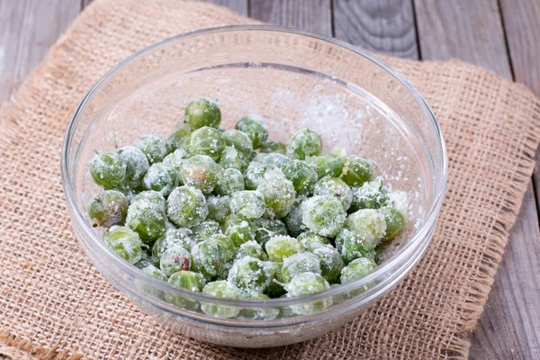 Gooseberry with sugar in a glass bowl — Stock Photo, Image