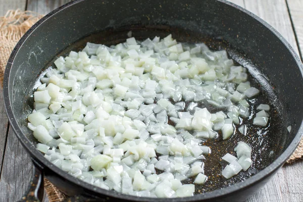 Onion being fried on a frying pan — Stock Photo, Image
