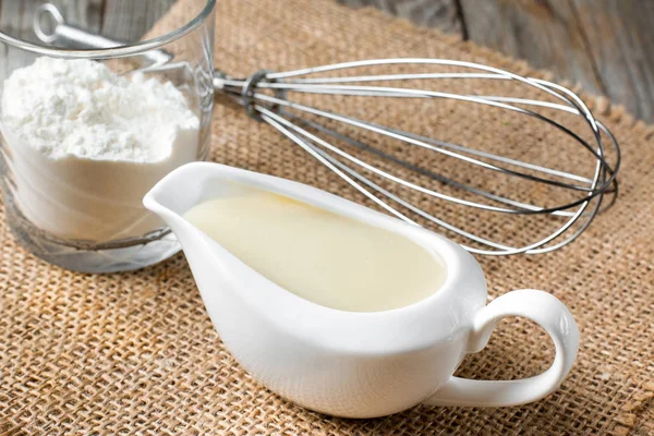 Bechamel white sauce in gravy boat — Stock Photo, Image