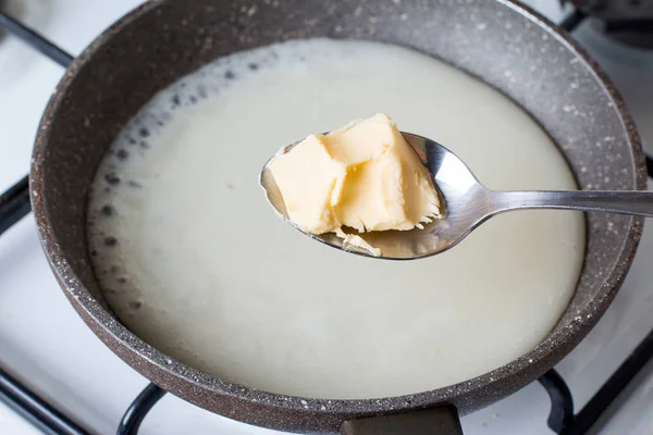 Preparing bechamel sauce boiling butter — Stock Photo, Image