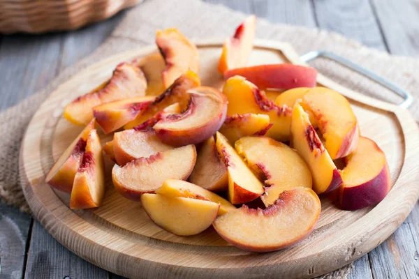 Pieces of peaches on a cutting board