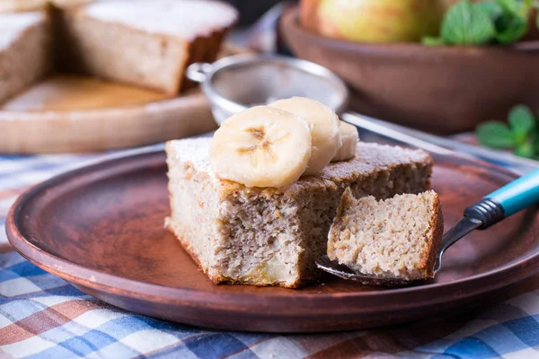 Slice of banana cake on a plate — Stock Photo, Image