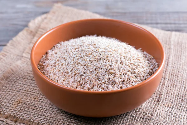 Barley in a bowl on the table — Stock Photo, Image