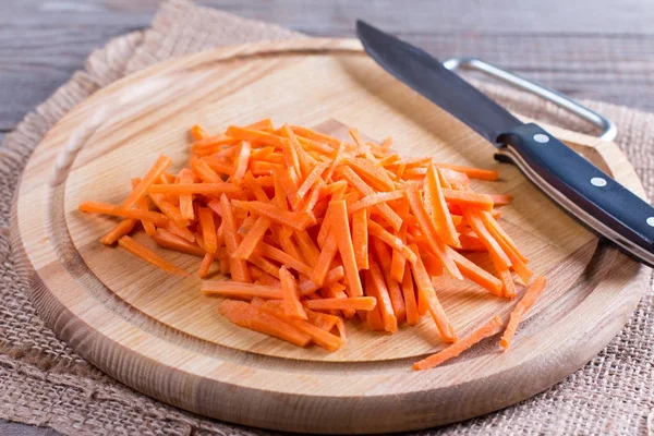 Sliced carrots on a cutting board — Stock Photo, Image